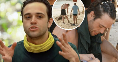 Erik Reinfeldt gestikulerar under intervju, infogad bild visar två män som går på strand