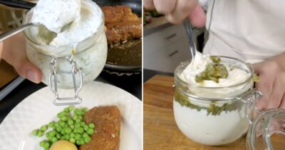 Fisk på en tallrik med en burk vit sås gjord på creme fraiche